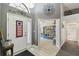 Inviting foyer showcasing the front door with sidelights and views to other rooms at 9336 Creekside Ct, Hudson, FL 34669