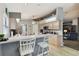Bright kitchen featuring a breakfast bar with seating, wood cabinets, and modern appliances at 9336 Creekside Ct, Hudson, FL 34669