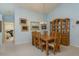 Dining room featuring a wooden dining table, matching chairs, and a display cabinet at 9405 Palm Haven Ct, New Port Richey, FL 34655