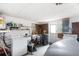 Laundry room with washer, dryer, shelving, and door to backyard at 10736 Queens Rd, Port Richey, FL 34668