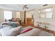 Open-concept living room boasts wood floors and a pass-through to the kitchen at 10736 Queens Rd, Port Richey, FL 34668