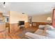 Inviting living room with wood laminate floors, and a neutral color palette at 10736 Queens Rd, Port Richey, FL 34668