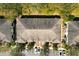 Bird's-eye view of townhome roofs and parking, displaying the community's layout and building structures at 10936 Keys Gate Dr, Riverview, FL 33579