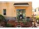 A cozy backyard with a small patio, plants, and a grill at 10936 Keys Gate Dr, Riverview, FL 33579