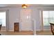 Bright entryway with wood-look vinyl floors, neutral walls, and natural light from side windows at 10936 Keys Gate Dr, Riverview, FL 33579