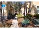 Townhome exteriors feature landscaped walkways between buildings at 10936 Keys Gate Dr, Riverview, FL 33579
