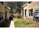 Townhome exteriors feature landscaped walkways and manicured lawns at 10936 Keys Gate Dr, Riverview, FL 33579
