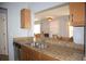 Spacious kitchen with a granite countertop and stainless steel sink at 10936 Keys Gate Dr, Riverview, FL 33579