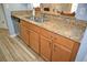 Kitchen boasts granite countertops and stainless steel dishwasher at 10936 Keys Gate Dr, Riverview, FL 33579