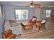 Living room showcasing tile flooring, large windows, sofa, chairs, and decorative coffee table at 10936 Keys Gate Dr, Riverview, FL 33579