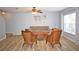 Bright living room featuring tile floors, comfortable seating, and a ceiling fan at 10936 Keys Gate Dr, Riverview, FL 33579