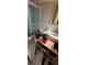 Functional bathroom featuring shower, vanity with sink, and an additional storage unit at 11617 Duda Rd, Hudson, FL 34667