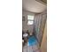 Functional bathroom featuring a shower, toilet, and window; the neutral color palette provides a blank canvas at 11617 Duda Rd, Hudson, FL 34667