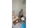 Cozy bathroom features a toilet, vanity with a sink and some storage at 11617 Duda Rd, Hudson, FL 34667