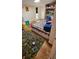 This playroom bedroom features a twin bed, toys, and a fun area rug at 11617 Duda Rd, Hudson, FL 34667