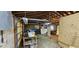 Spacious garage with exposed rafters and pegboard walls awaiting organization at 11617 Duda Rd, Hudson, FL 34667