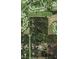 Aerial view of wooded lot in residential area with golf course and ponds nearby at 11617 Duda Rd, Hudson, FL 34667
