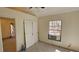 Bedroom featuring an exterior window and closet with double doors at 11617 Duda Rd, Hudson, FL 34667