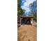 Exterior view of a covered structure, showcasing a rural outdoor storage and recreational space at 11617 Duda Rd, Hudson, FL 34667