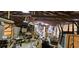 Interior of cluttered garage space, offering potential for storage or a workshop at 11617 Duda Rd, Hudson, FL 34667
