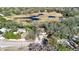 Expansive aerial view of a home nestled among trees, situated near a scenic marshland at 12724 Circle Lake Dr, Hudson, FL 34669