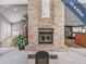 Cozy seating area featuring a brick fireplace, perfect for reading a book at 1322 Hickory Moss Pl, Trinity, FL 34655