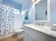 Bright bathroom featuring a shower/tub combination and vanity with a marble countertop at 13304 Mandalay Pl, Spring Hill, FL 34609