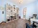 Comfortable bedroom with a full wall bookcase and rocking chairs at 13304 Mandalay Pl, Spring Hill, FL 34609