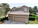 Two story home featuring an attached two car garage, neutral color scheme, and well maintained landscaping at 13304 Mandalay Pl, Spring Hill, FL 34609