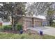 Two story home featuring an attached two car garage and well maintained landscaping at 13304 Mandalay Pl, Spring Hill, FL 34609