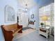 Inviting foyer with bench seating, neutral flooring, and statement mirror at 13304 Mandalay Pl, Spring Hill, FL 34609