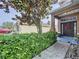 Charming front entrance featuring a blue welcome mat and a decorative wreath on the front door at 13304 Mandalay Pl, Spring Hill, FL 34609