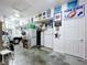 Organized garage featuring storage solutions, white car, and a concrete floor at 13304 Mandalay Pl, Spring Hill, FL 34609