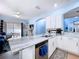 Gourmet kitchen features marble countertops, island seating, and an open layout to the outdoor patio at 13304 Mandalay Pl, Spring Hill, FL 34609