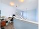 Loft area featuring built-in desk and storage with an industrial pendant light at 13304 Mandalay Pl, Spring Hill, FL 34609