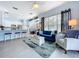 Bright living room featuring an open concept layout with a kitchen and an eat-in dining area at 13304 Mandalay Pl, Spring Hill, FL 34609