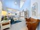 Open concept living room with blue walls, and high ceilings at 13304 Mandalay Pl, Spring Hill, FL 34609