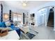 Spacious living room showcasing an open floor plan, patio access, and staircase at 13304 Mandalay Pl, Spring Hill, FL 34609