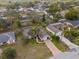 Lovely neighborhood showcasing the property with a mature landscape at 1382 Aladdin Rd, Spring Hill, FL 34609
