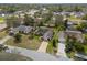 Beautiful aerial view showcases this home, lush landscaping, and the quiet neighborhood at 1382 Aladdin Rd, Spring Hill, FL 34609