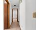 Hallway with tile flooring, neutral walls and wood trim at 1382 Aladdin Rd, Spring Hill, FL 34609