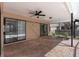 Screened-in lanai with brick floor that includes both a pool and a spa at 1382 Aladdin Rd, Spring Hill, FL 34609