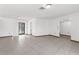 Bright living room with tile flooring and a glass door offering plenty of natural light and a pool view at 1382 Aladdin Rd, Spring Hill, FL 34609