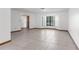 Bright living room with tile flooring, light walls and a bay window that offers plenty of natural light at 1382 Aladdin Rd, Spring Hill, FL 34609