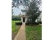 Home exterior with dark shutters and a small porch leading to the front door at 15772 Stable Run Dr, Spring Hill, FL 34610