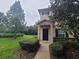 Charming townhouse with manicured front lawn and walkway leading to the front door at 15772 Stable Run Dr, Spring Hill, FL 34610