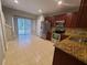 Kitchen with stainless steel appliances, granite counters, and tiled flooring at 15772 Stable Run Dr, Spring Hill, FL 34610