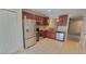 Updated kitchen featuring stainless appliances, wood cabinets, and tile floors at 15772 Stable Run Dr, Spring Hill, FL 34610