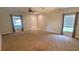 Spacious living room with natural light from the large windows at 15772 Stable Run Dr, Spring Hill, FL 34610