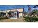 The screened in patio is next to a grassy side yard at 15772 Stable Run Dr, Spring Hill, FL 34610